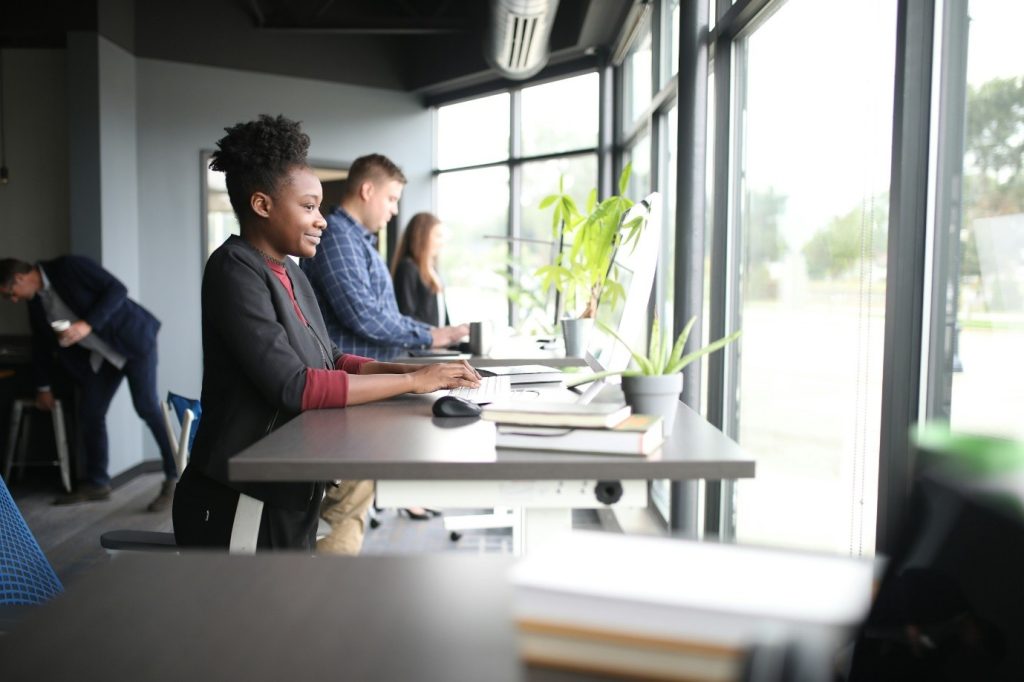 an office space with a lady doing social engineering scam protection training